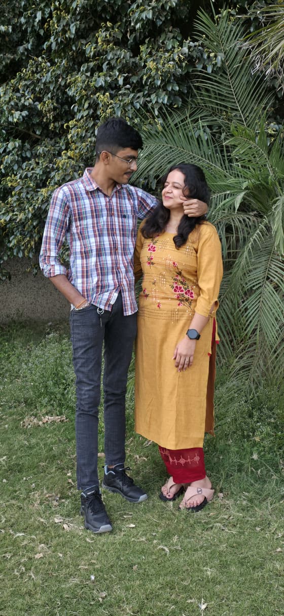 The two of us standing together, my arm around you, you looking up at me.
