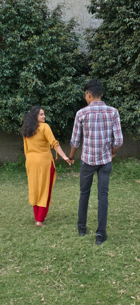 The two of us walking away hand in hand, you turning back towards the camera.
